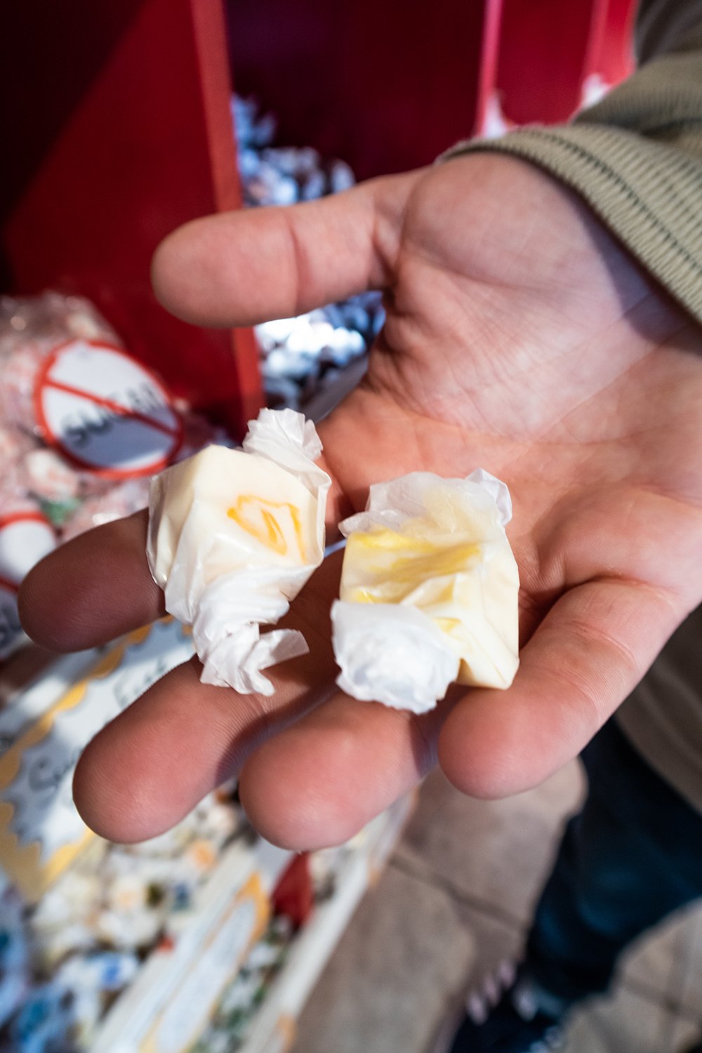 man holding saltwater taffy in his hand