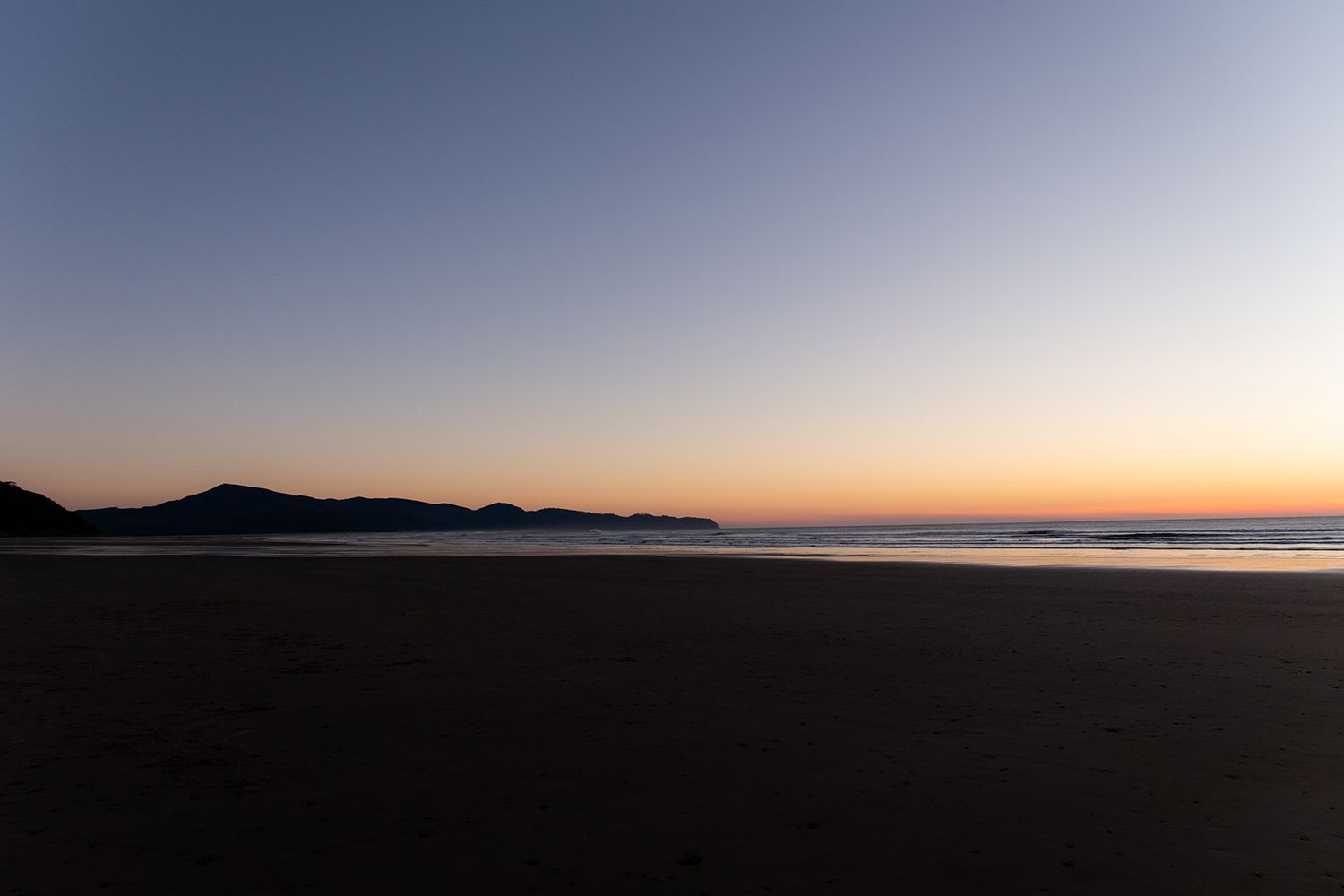 sunset at the beach in oceanside, oregon