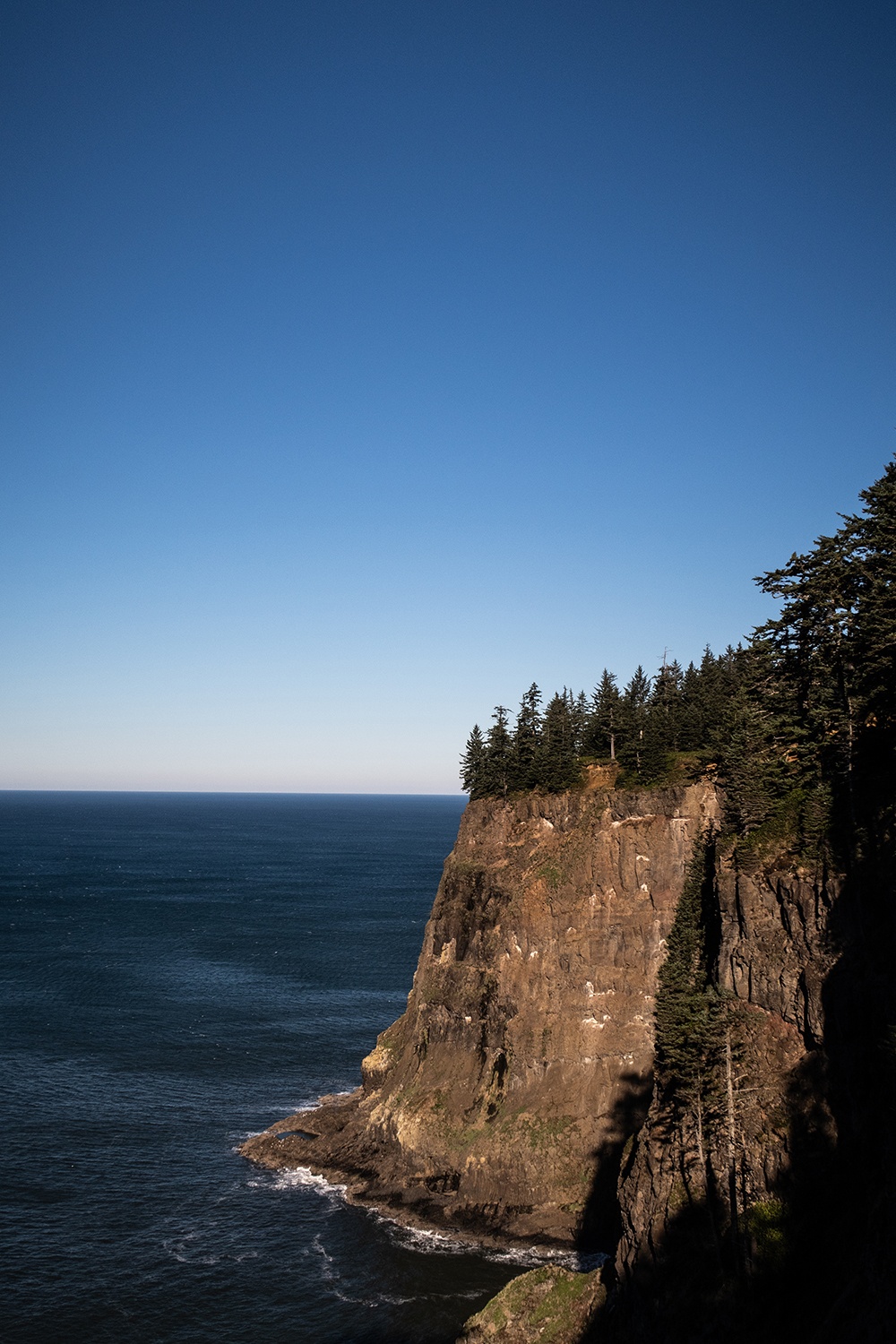 cliff by ocean in oceanside, oregon