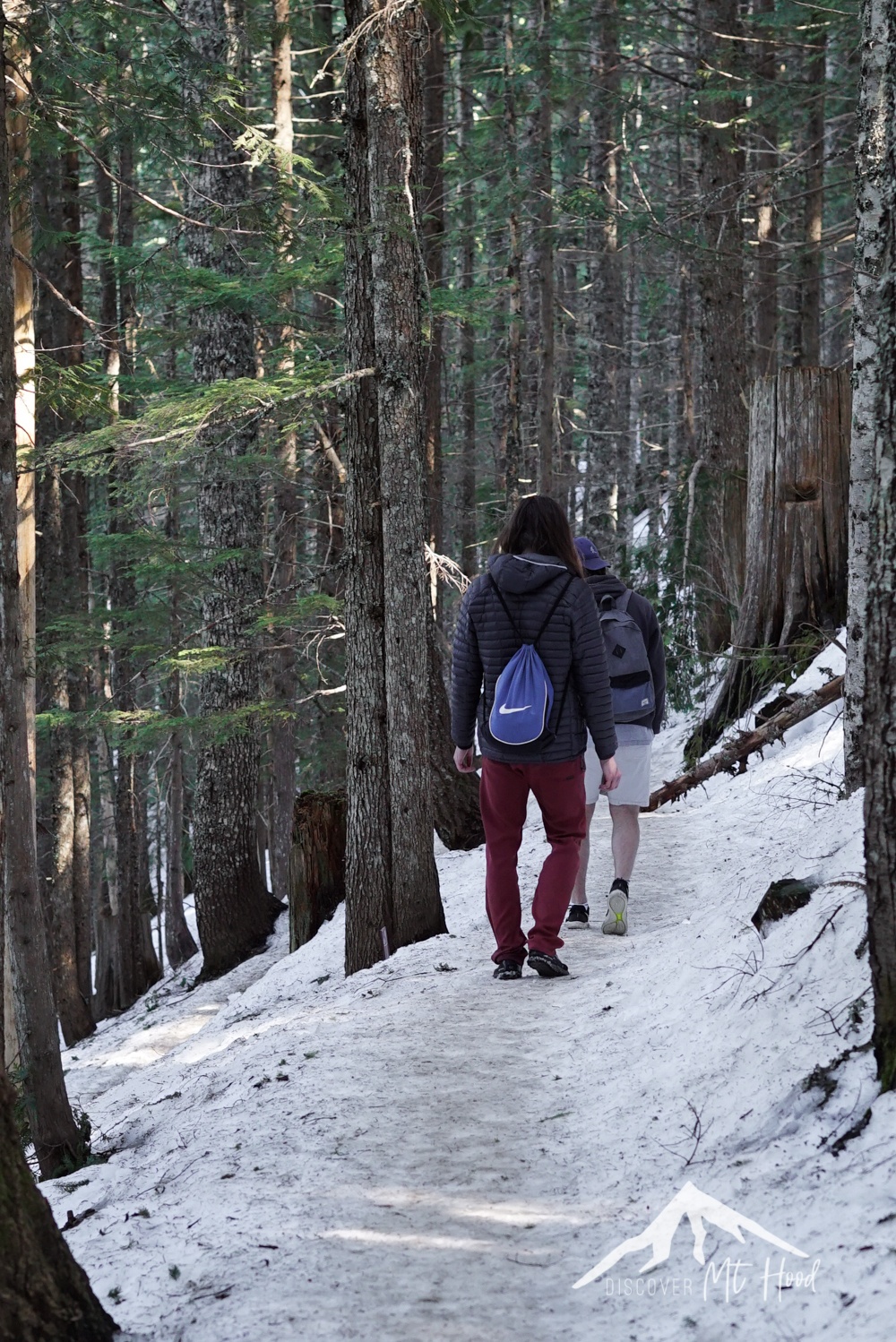 Two guys walking on the mirror lake trail